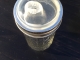 Nuby sippy cup lid on a 12-ounce jar